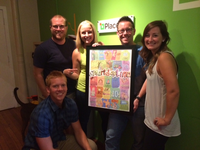 Placefull team happily accepts their smartdept. inc. poster!